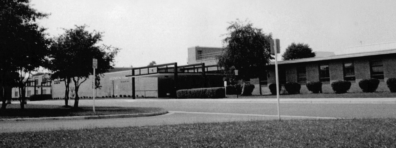 Black and white photograph of the front of Herndon High School’s 1967 building. The date the photograph was taken is unknown.